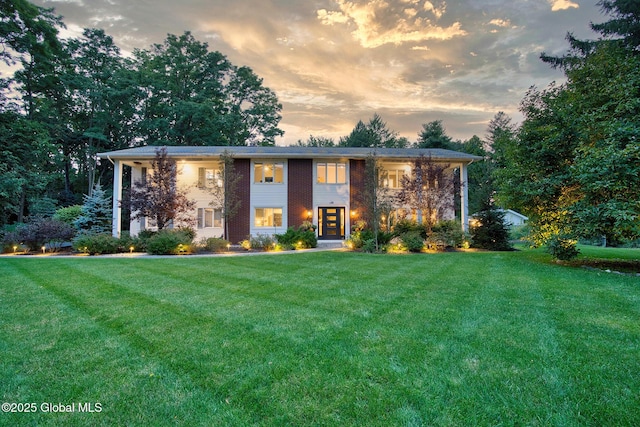 view of front of house with a lawn