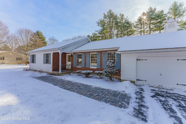 single story home with a garage