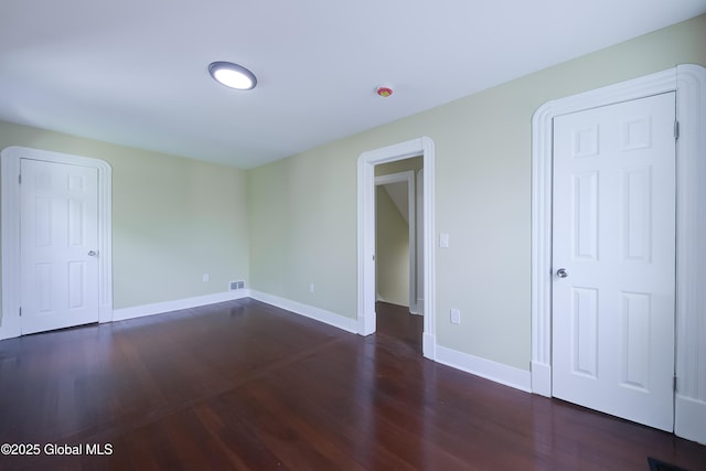 801 Holland Rd, Schenectady, NY 12303 - unfurnished bedroom with wood finished floors and baseboards