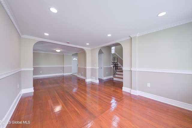 801 Holland Rd, Schenectady, NY 12303 - unfurnished room with arched walkways, wood finished floors, recessed lighting, stairs, and crown molding