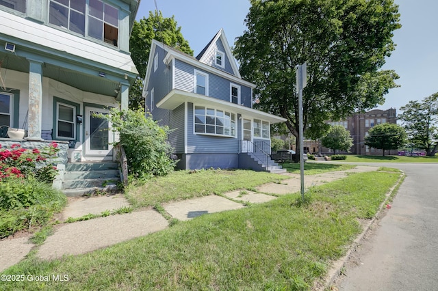 801 Holland Rd, Schenectady, NY 12303 - view of front facade with a porch and a front lawn