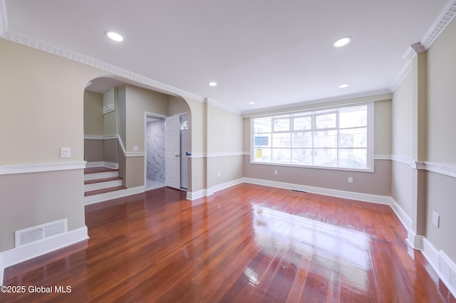 801 Holland Rd, Schenectady, NY 12303 - empty room with arched walkways, crown molding, wood finished floors, stairs, and recessed lighting