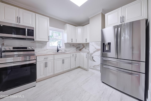 801 Holland Rd, Schenectady, NY 12303 - kitchen with appliances with stainless steel finishes, crown molding, white cabinets, tasteful backsplash, and light marble finish floors