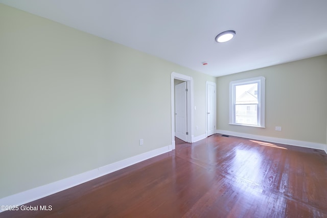 801 Holland Rd, Schenectady, NY 12303 - empty room featuring dark wood-style flooring and baseboards