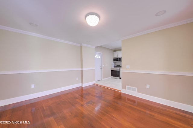 801 Holland Rd, Schenectady, NY 12303 - spare room featuring light wood-style flooring and ornamental molding