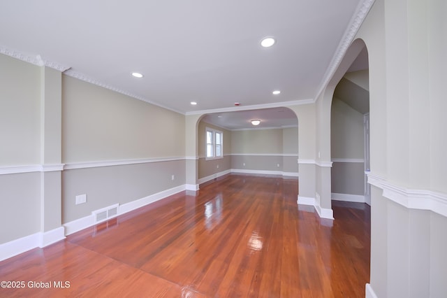 801 Holland Rd, Schenectady, NY 12303 - unfurnished room featuring arched walkways, wood finished floors, recessed lighting, ornamental molding, and decorative columns