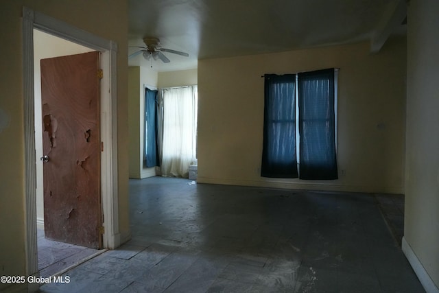 empty room featuring ceiling fan