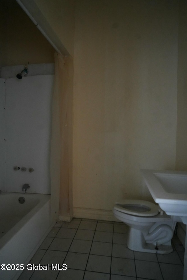 bathroom featuring tile patterned floors,  shower combination, and toilet