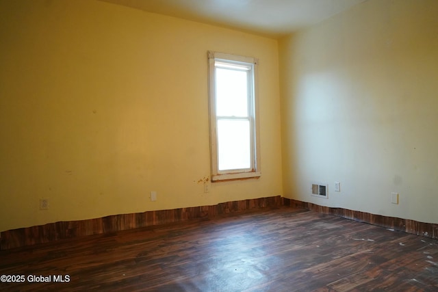 empty room featuring dark hardwood / wood-style floors