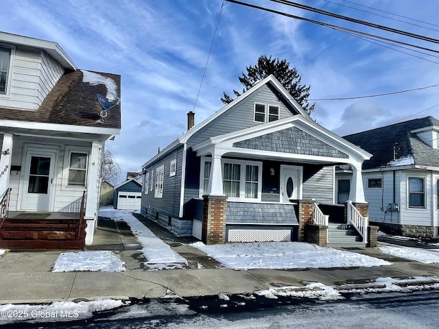 view of front of home with an outbuilding and a garage