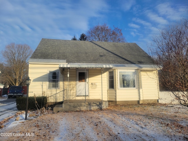 bungalow-style house with a shingled roof