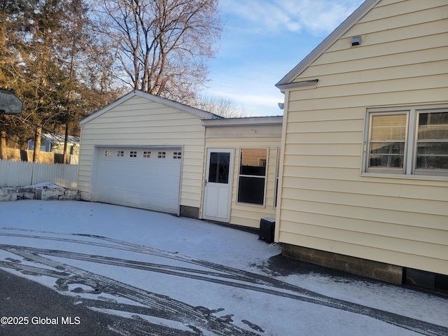 view of snow covered garage