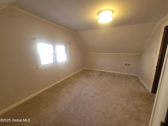 bonus room with lofted ceiling and carpet floors