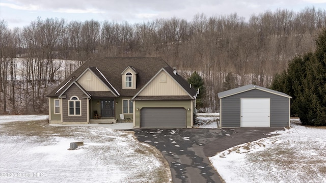 view of front of home featuring a garage and an outdoor structure