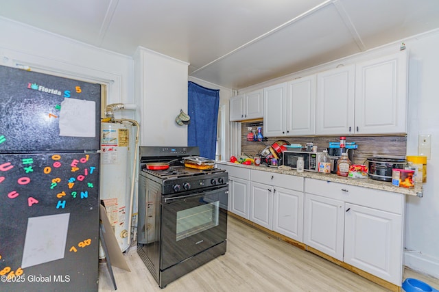 kitchen featuring gas water heater, white cabinetry, light hardwood / wood-style floors, and black appliances