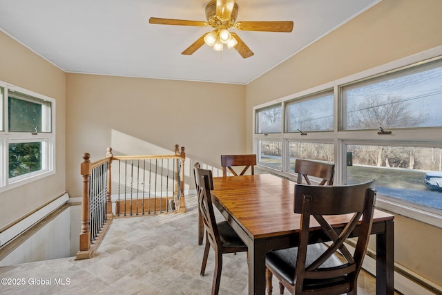 dining room with a baseboard radiator and ceiling fan