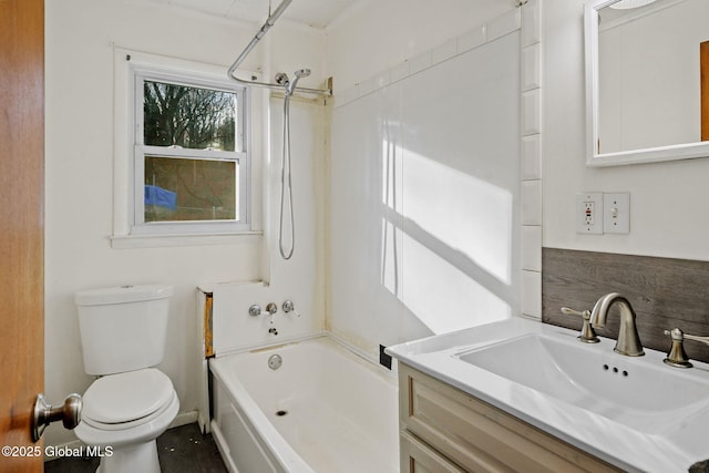 full bathroom featuring toilet, vanity, and washtub / shower combination