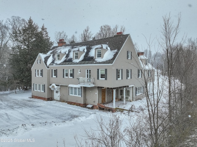 view of front of house featuring a balcony