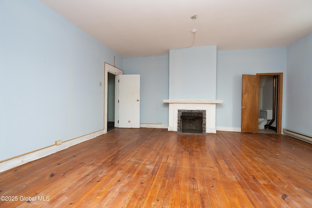 unfurnished living room featuring hardwood / wood-style flooring