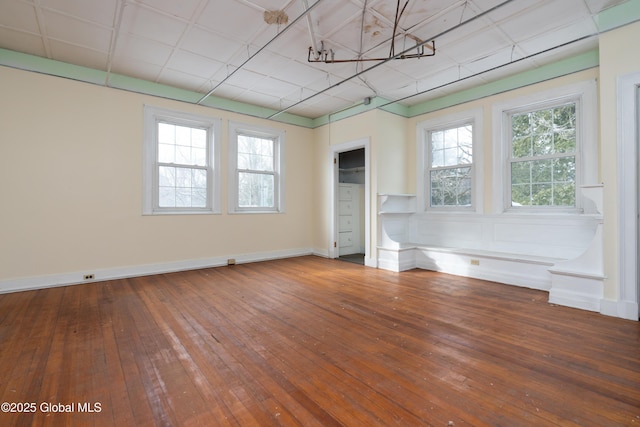 unfurnished room featuring hardwood / wood-style flooring