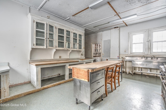 kitchen featuring wood counters and a center island