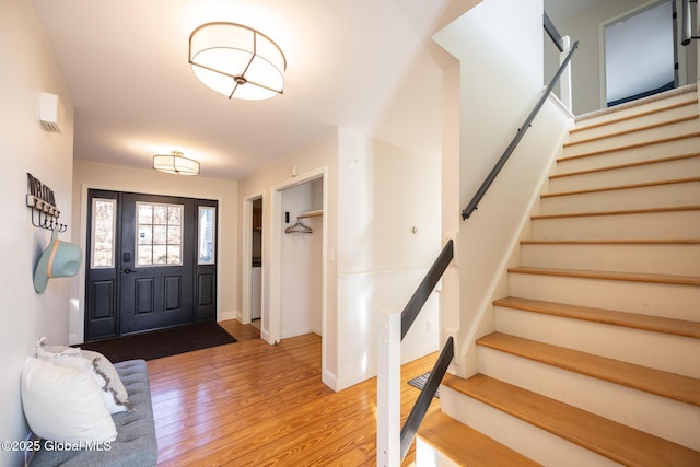 foyer entrance with hardwood / wood-style floors