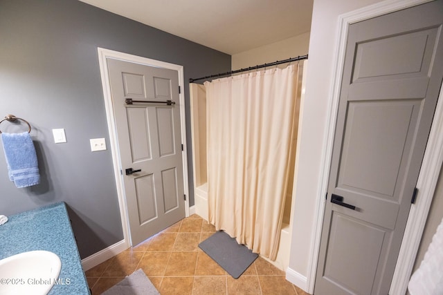 bathroom featuring tile patterned floors, shower / bath combo with shower curtain, and vanity