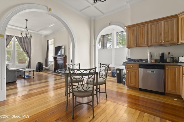 kitchen with dishwasher, light wood-type flooring, a wealth of natural light, and a notable chandelier