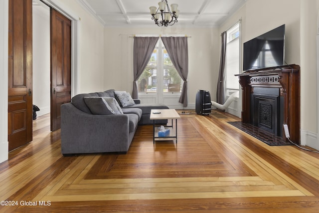 living room featuring parquet floors, coffered ceiling, and an inviting chandelier