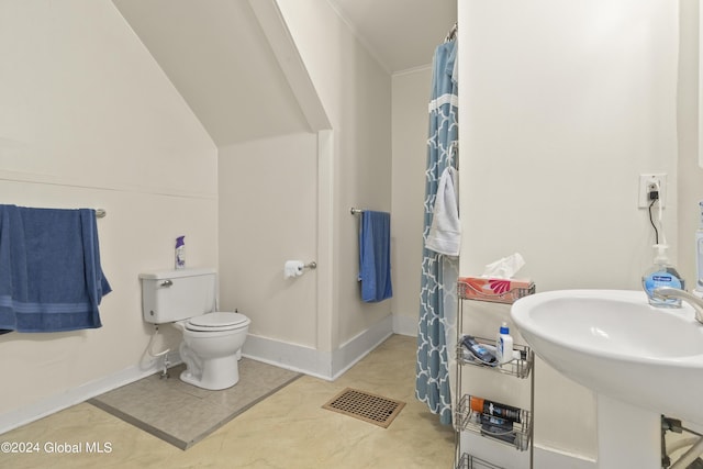 bathroom featuring tile patterned floors, sink, and toilet