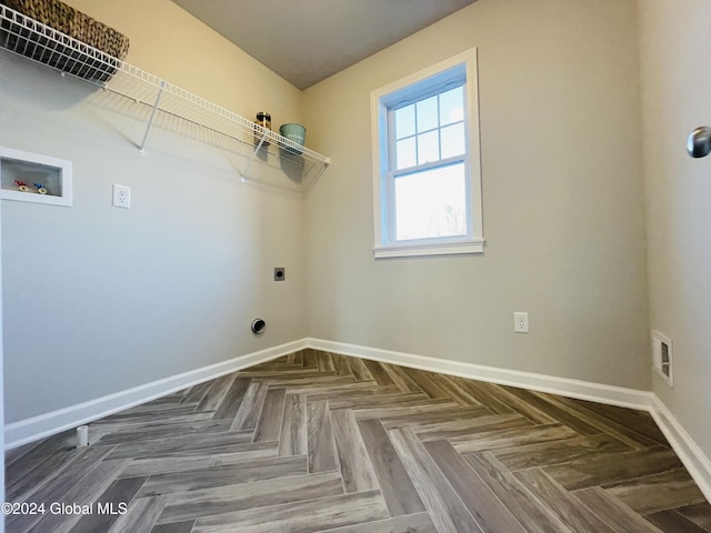 washroom with hookup for a washing machine, electric dryer hookup, and parquet flooring