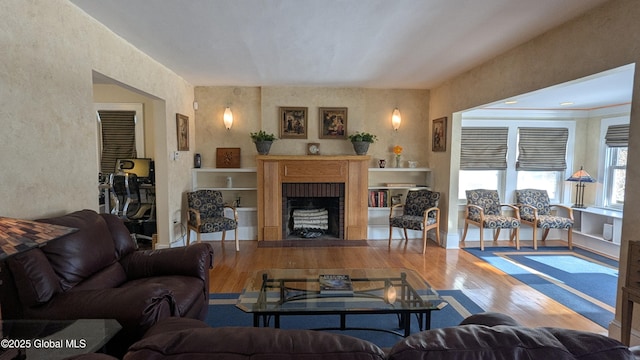 living area featuring a fireplace and hardwood / wood-style floors