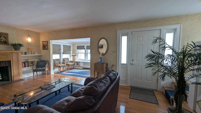 living room featuring a fireplace and wood finished floors