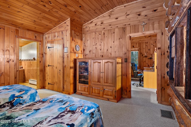 bedroom with light carpet, vaulted ceiling, baseboard heating, and wooden ceiling