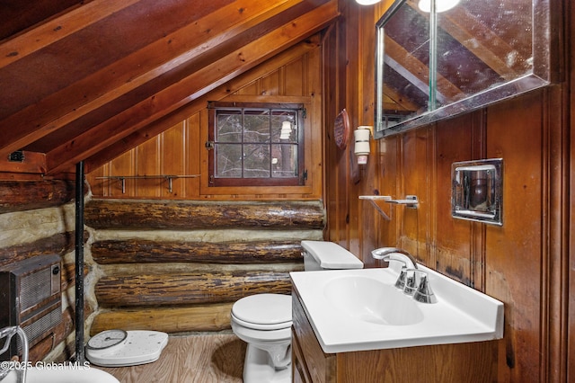 bathroom with lofted ceiling with beams, toilet, wooden walls, and log walls