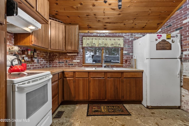 kitchen featuring brick wall, wood ceiling, white appliances, sink, and lofted ceiling