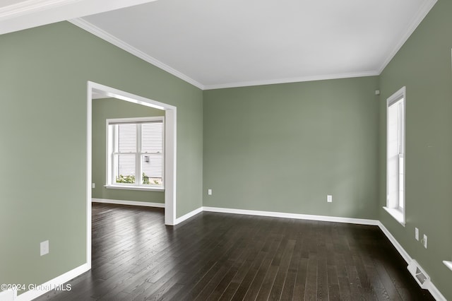 unfurnished room with crown molding and dark wood-type flooring