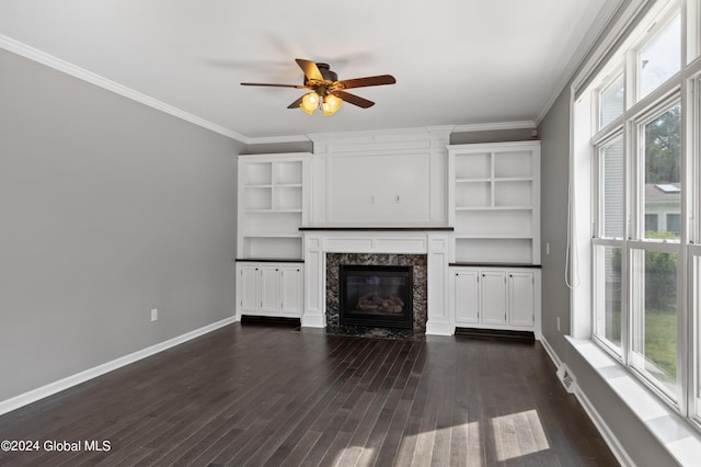 unfurnished living room with a fireplace, ceiling fan, dark hardwood / wood-style flooring, and crown molding