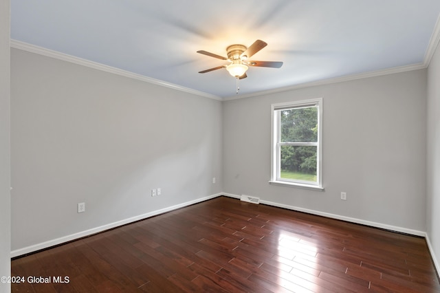 spare room with crown molding, ceiling fan, and dark hardwood / wood-style floors