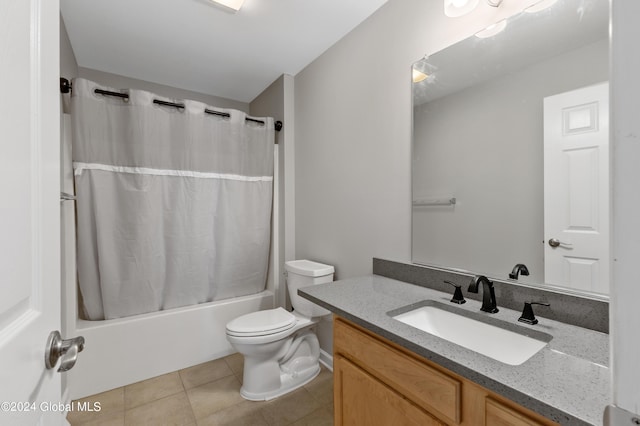 full bathroom with shower / tub combo, vanity, toilet, and tile patterned floors