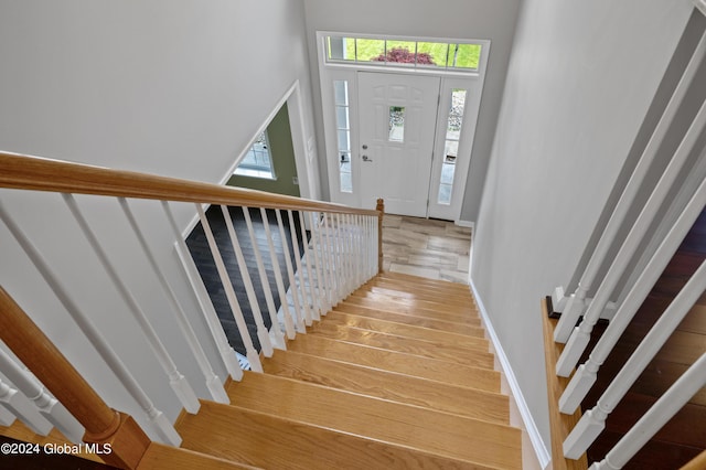 staircase with a wealth of natural light