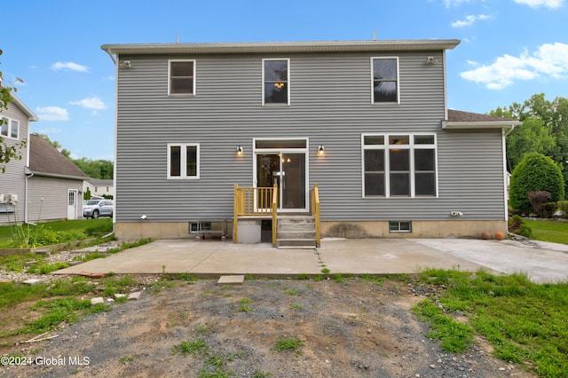 back of house with a patio