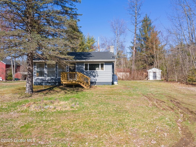 115 Chambers St, Broadalbin, NY 12025 - view of front of home with a chimney, a front lawn, and a sunroom