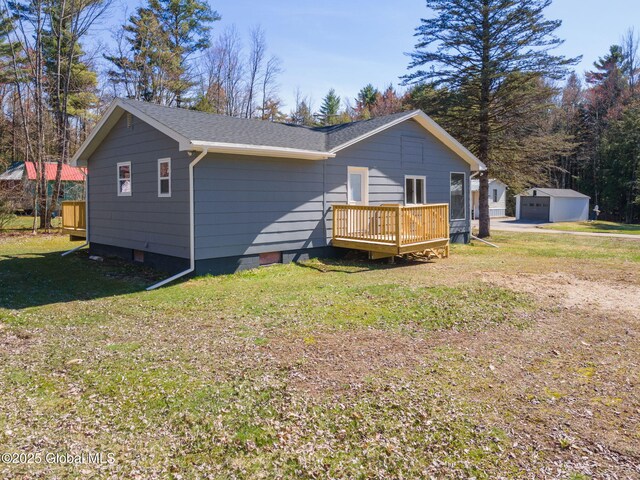 115 Chambers St, Broadalbin, NY 12025 - rear view of property featuring a deck, an outbuilding, a yard, roof with shingles, and crawl space