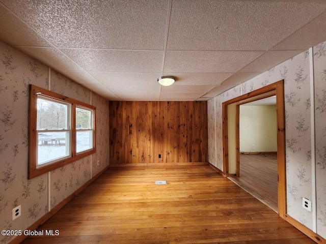 spare room with hardwood / wood-style floors