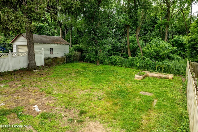 29 Lockrow Blvd, Colonie, NY 12205 - view of yard featuring a vegetable garden and a garage