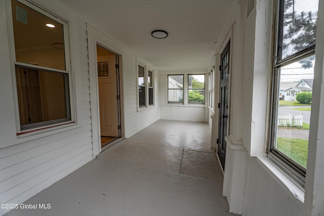 29 Lockrow Blvd, Colonie, NY 12205 - unfurnished sunroom with concrete flooring and wood walls