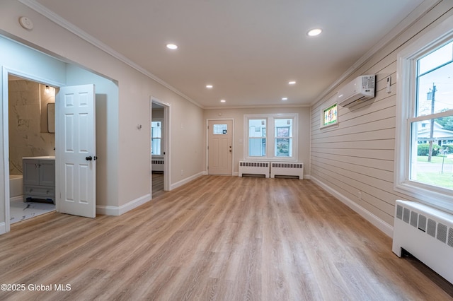 29 Lockrow Blvd, Colonie, NY 12205 - unfurnished room with radiator, a wall unit AC, ornamental molding, light wood-type flooring, and plenty of natural light