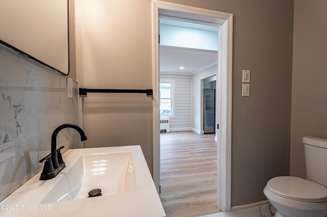 29 Lockrow Blvd, Colonie, NY 12205 - bathroom featuring radiator, ornamental molding, and wood finished floors