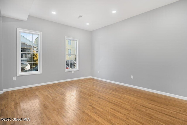 unfurnished room with light hardwood / wood-style flooring